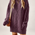 Women's cable-textured sweater dress on a light neutral background