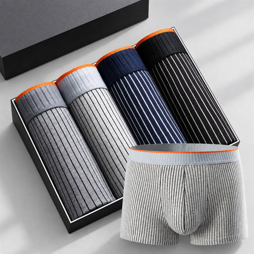 Striped grey, navy and black cotton boxers presented in a box