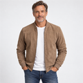 Man aged around 50 wearing a beige suede-look bomber jacket