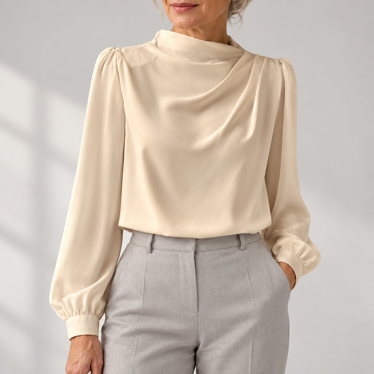 Women's draped blouse with gathered neckline and long sleeves